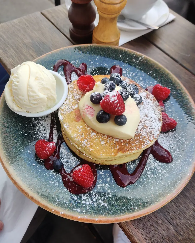 Pancakes with berries and ice cream