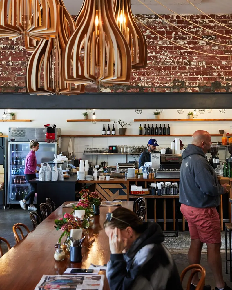 Timber pendant lights over the counter at Olie and Ari